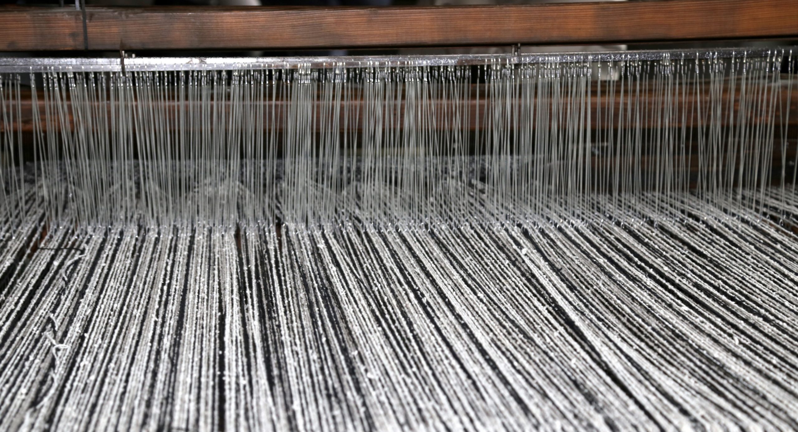 ancient textile loom of wood with black and white color woolen t