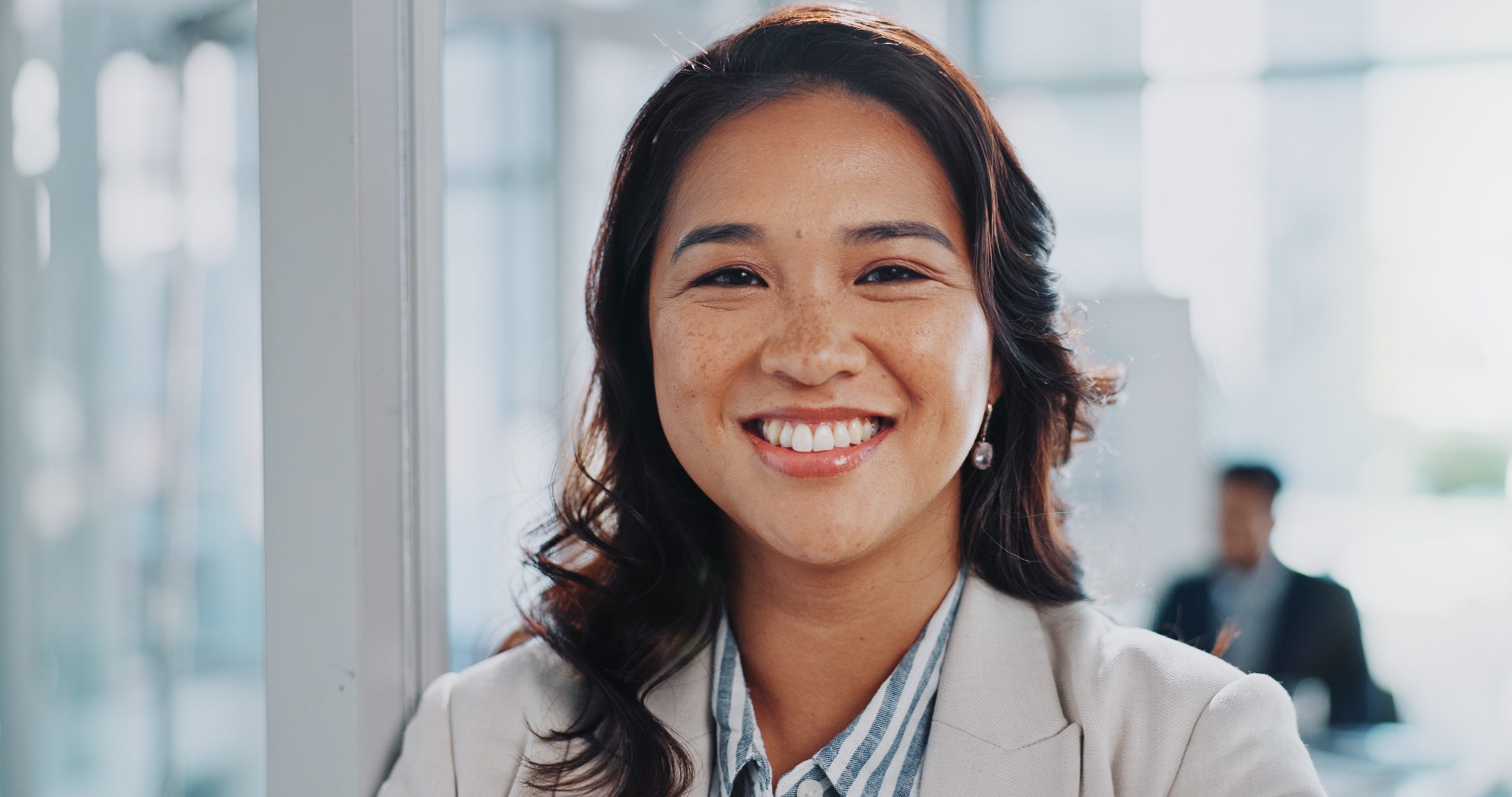 Portrait, business and woman in office, smile and professional with corporate job, career ambition and confident. Face, employee in finance with consulting agency or accountant with pride in Malaysia