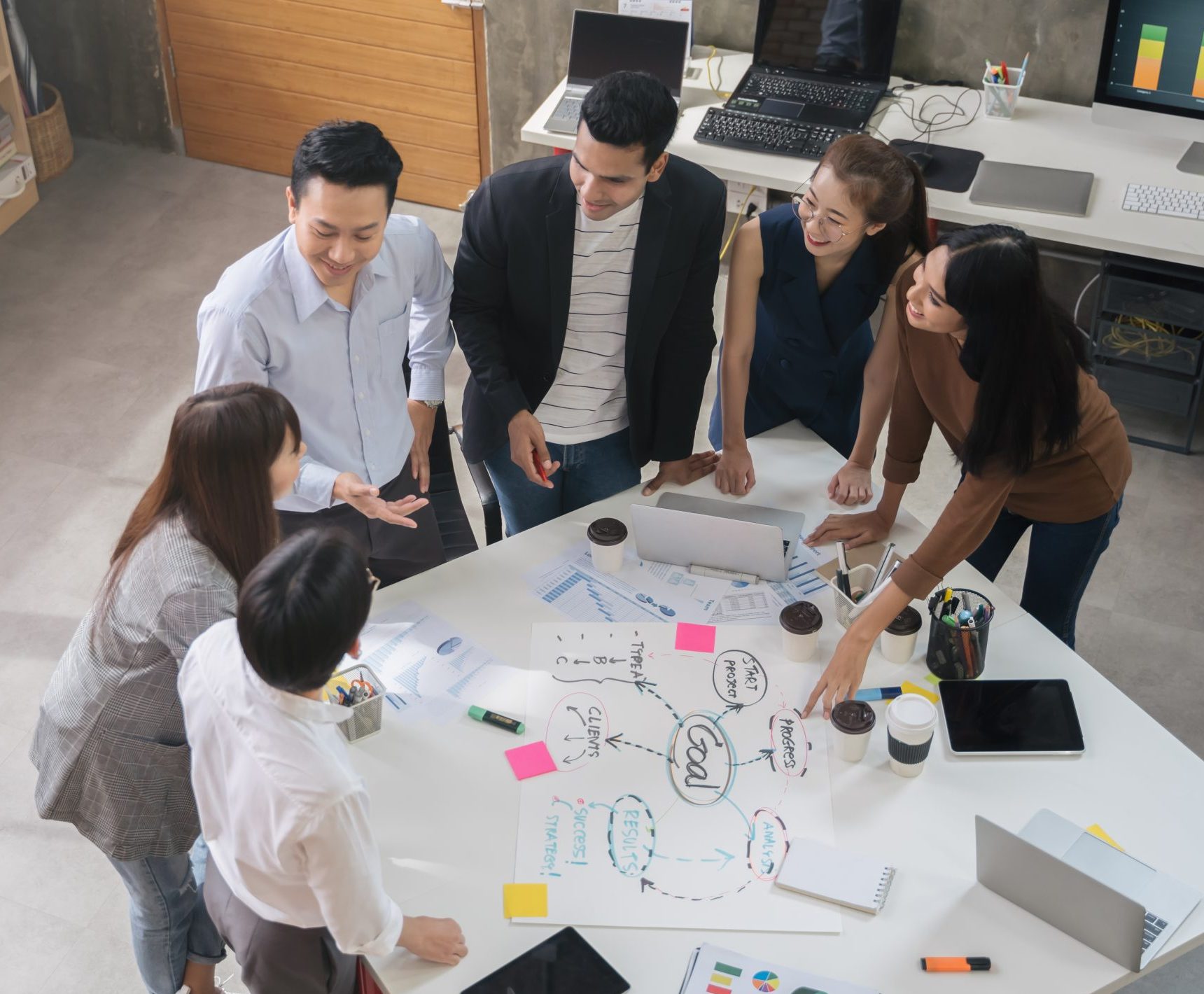 Group of Asian business people team meeting in modern office working design planning and ideas concept