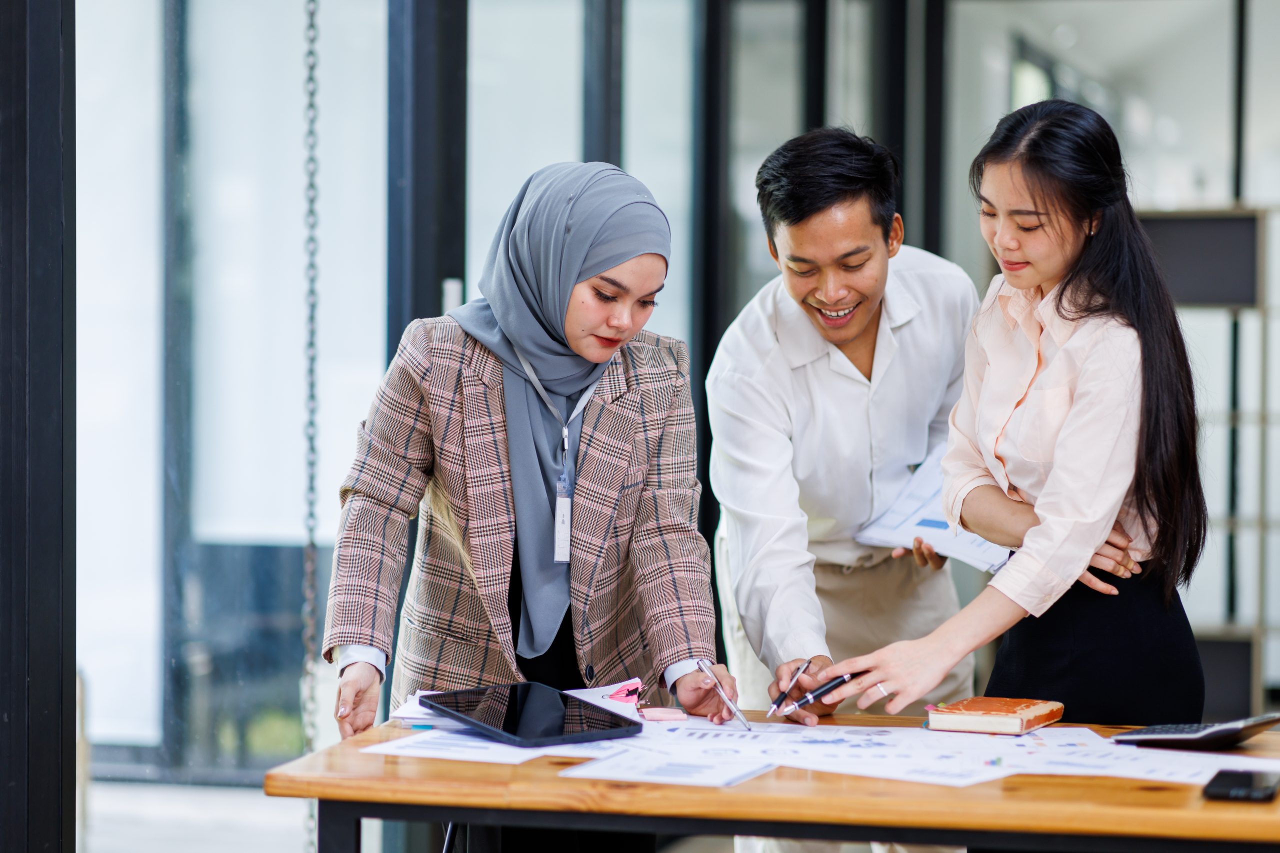 Young business asian colleague discussion with window background Financial Advisor discussion with client.